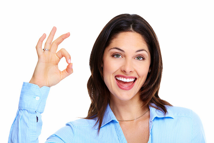 Happy young business woman isolated on white background.